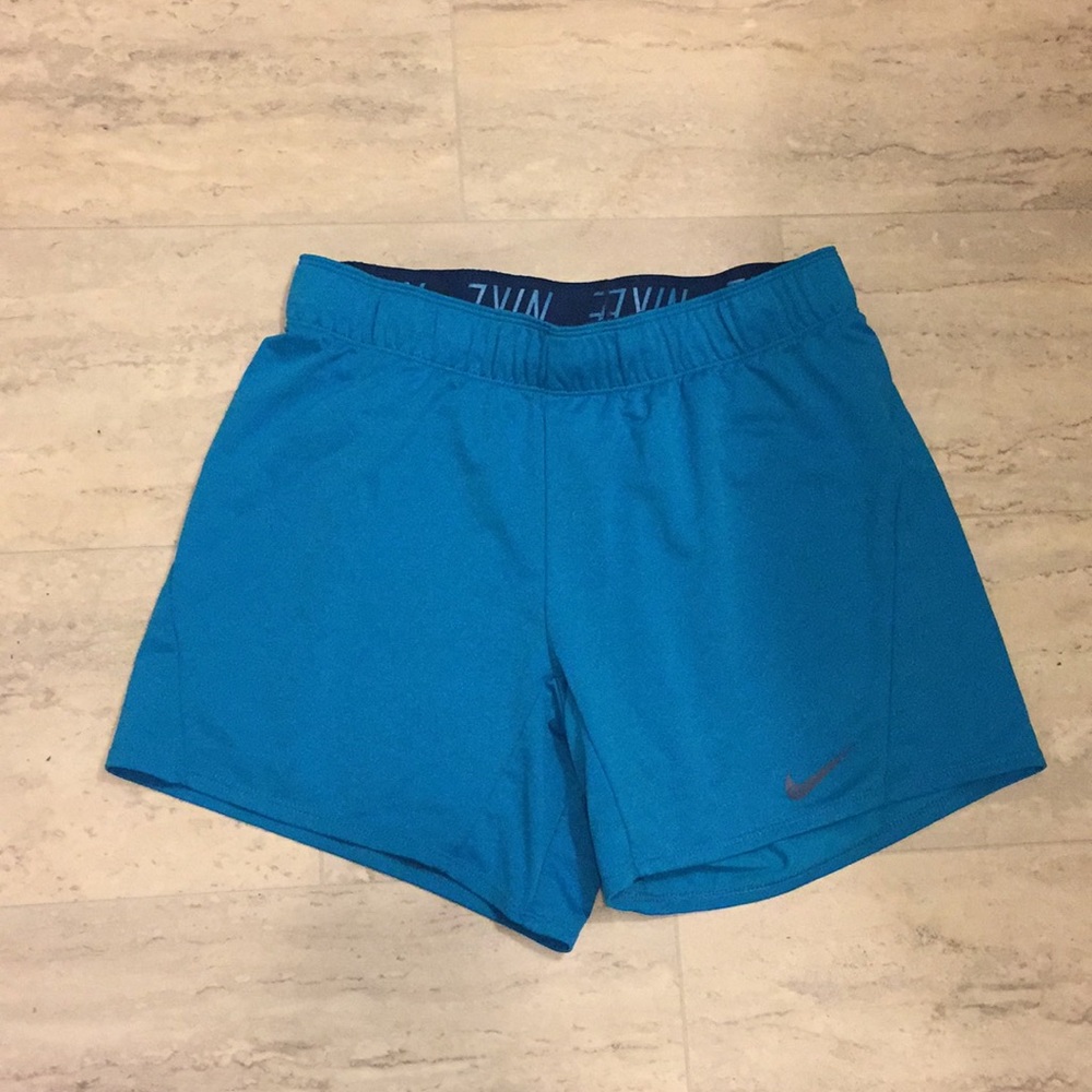 Blue Nike track shorts